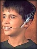 A boy wearing orthodontic headgear