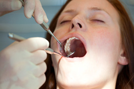 Woman having her teeth cleaned