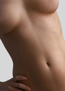 A woman's midriff with the lower portion of the breasts visible